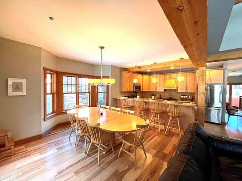 Dining room connecting to Kitchen and counter seating.
