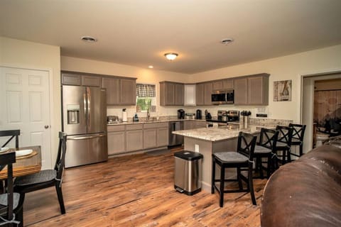 Large kitchen with all your cooking and baking needs. SS appliances, granite countertop. Seating for 4.