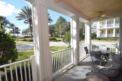 South-facing wraparound balcony with 4 armchairs plus dining table and chairs