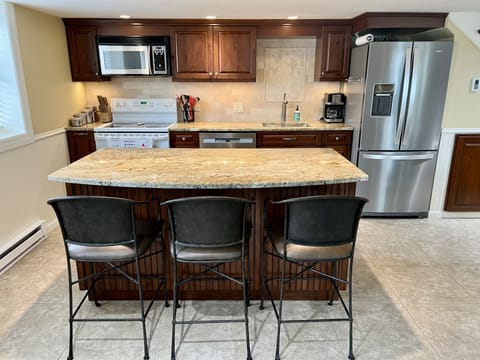Fully stocked kitchen with granite countertops. 