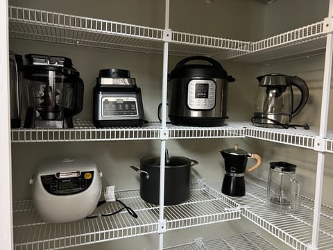 Kitchen is well equipped with small appliances for a variety of needs