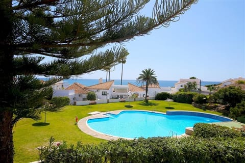 Stunning views to the pool, gardens and the sea from this property