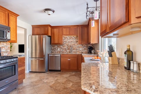 Spacious and fully equipped kitchen with spacious countertops