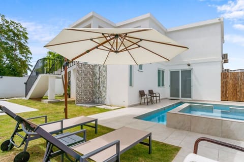 Your Private Pool. The highlight of the villa is the outdoor oasis. Our pool features shallow ledges for lounging, complete with a heated Jacuzzi. As recent guest Jake (April 2025) noted: `Loved... especially the heated outdoor pool and hot tub area. Kitc