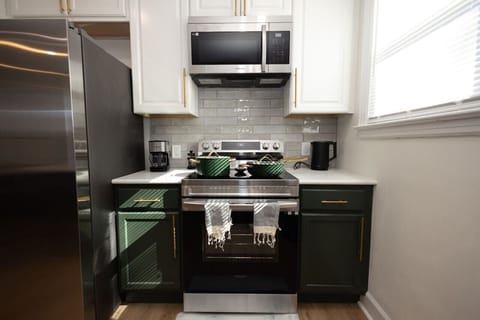 Experience culinary delight in our open-concept kitchen, seamlessly connected to the spacious living room. Whip up a feast in style as you savor the seamless flow of design, making every meal a shared experience.