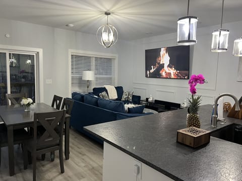 Living room with dining table for 6 people.