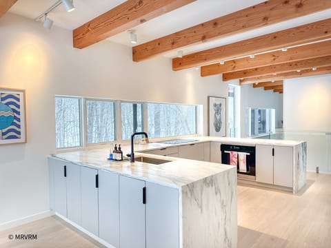 Into Kitchen from glass Living Room