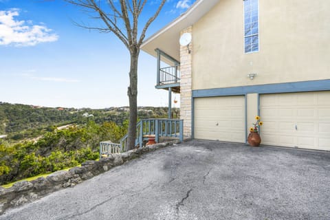 The Room with a View entrance is on the lower level deck to the left of parking