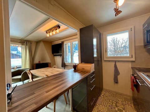 island table in kitchen connecting to the living room