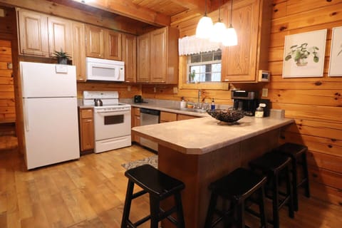 Kitchen with breakfast bar and seating for four