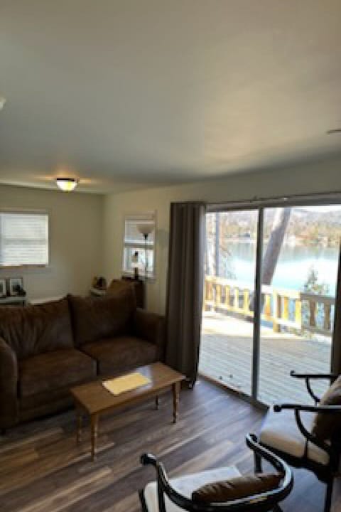 comfortable living room with a slider that leads out to the deck.