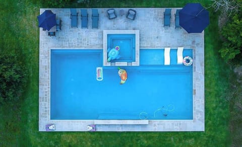 Dip into the Pool & Hot Tub privately tucked away in front of the house!