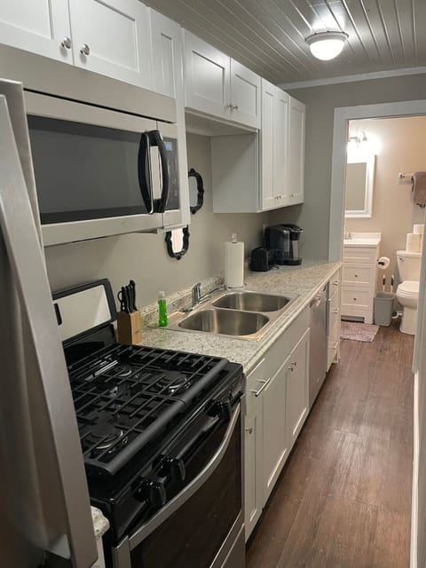 Fully equipped kitchen with modern appliances and ample counter space.