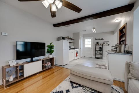 Open living space with a flat-screen TV and easy flow into the kitchen for a seamless stay