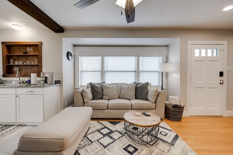 Inviting living room with comfy seating, warm décor, and a seamless flow into the kitchen