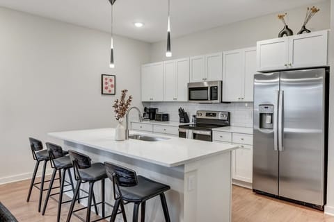 Pull up a seat at the kitchen bar—perfect for casual bites, morning coffee, or keeping the chef company.