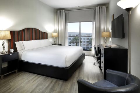 Unwind in crisp linens and bright, airy city views.