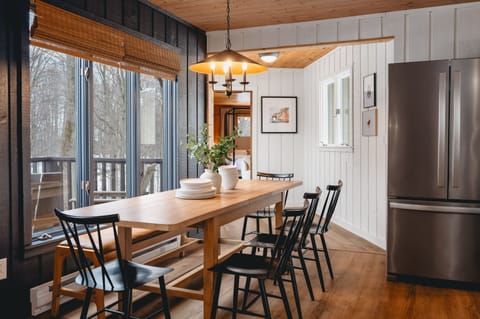 Dining room with seating for 8. There is seating for 2 at the kitchen island.
