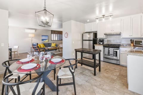 The dining area is conveniently located off the kitchen, offering plenty of space to enjoy meals together.