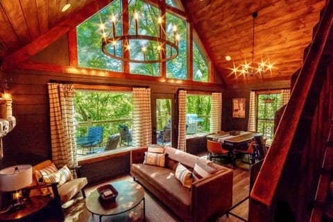 Upscale Open Concept Living Room with 55in Roku TV & Electric Fireplace.