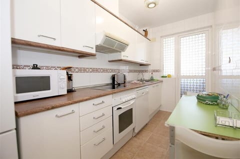 Kitchen is fully equipped with all the appliances (laundry room to the rear)