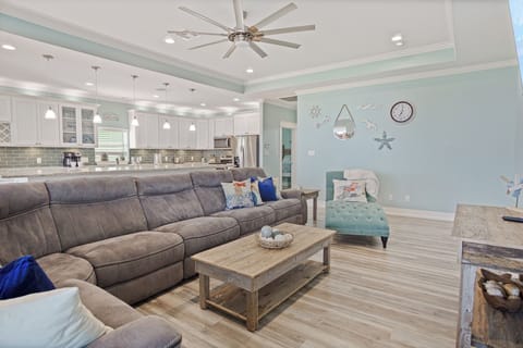 Feeling TipSea Living Room: Elevate your beach getaway experience in this beautifully appointed vacation rental, featuring an open-concept design that invites relaxation and entertainment. 
