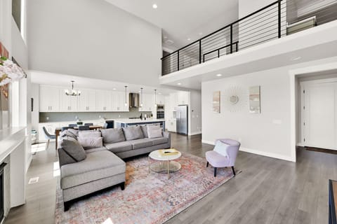 Living room and kitchen and entrance from garage