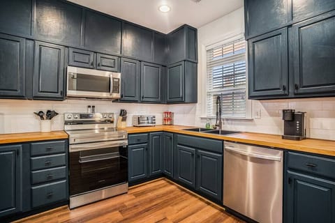 KITCHEN WITH NEW STAINLESS STEEL APPLIANCES AND KEURIG