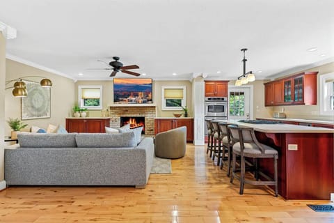 Open-concept living room with big-screen entertainment