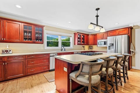 Fully stocked, spacious kitchen designed for group cooking and casual dining.