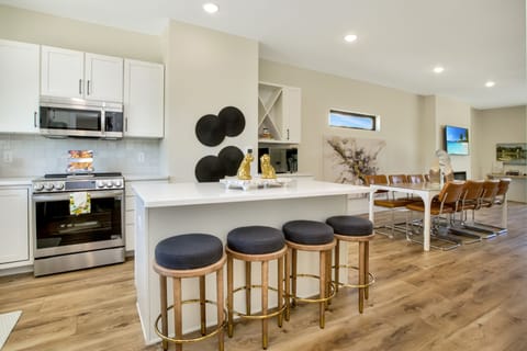 Quartz counters, stainless appliances, counter seating.