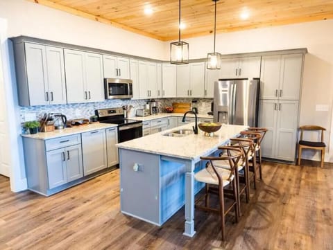 Fully stocked kitchen with coffee maker, blender, waffle maker, toaster