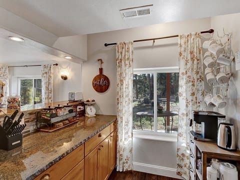 Coffee and tea station. Keurig Duo, electric kettle, French Press, coffee, tea and treats available for your stay.