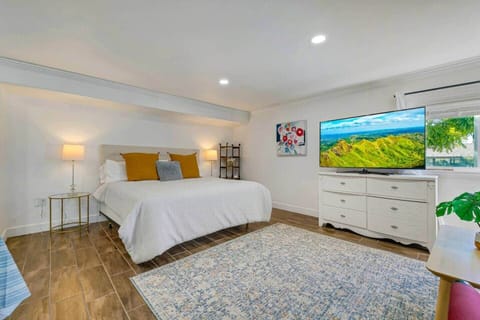 New king size bed, large Samsung Smart TV, tile flooring, private attached bath.