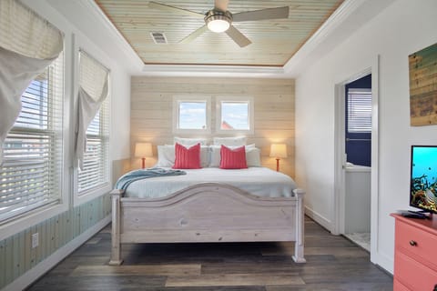 One Love Primary Bedroom 1: A sanctuary of tranquility featuring dual vanities and a spacious layout, promising a haven of comfort and style. 