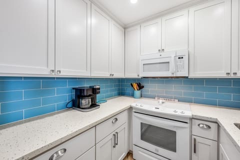 Sleek and inviting, this kitchen space is the start of flavor filled memories