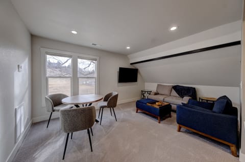Living room comfort with 55 inch TV and cable TV.