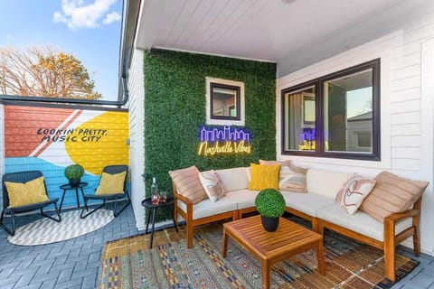 The rooftop patio is equipped with plenty of outdoor furniture, providing ample seating for everyone.