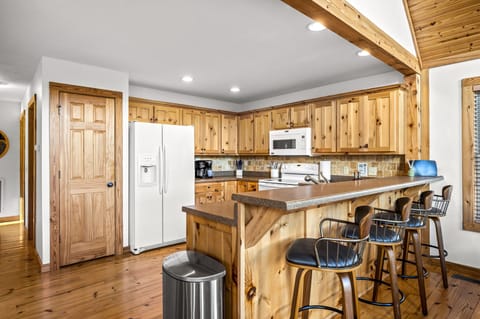 Four counter stools provide additional dining area seating. 