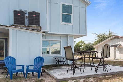 Relax and unwind in the outdoor dining area, complete with comfortable loungers and a BBQ grill for the perfect al fresco experience.