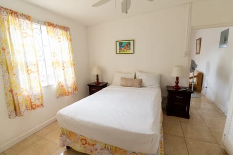 Unwind in a bright bedroom with crisp linens.