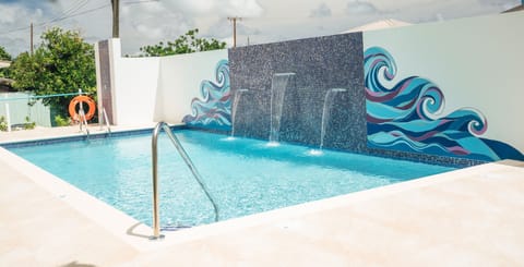 Cool off in the pool with soothing waterfall sounds