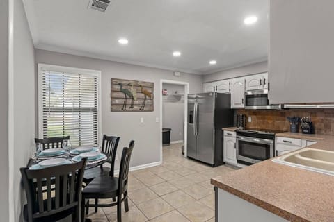Step into our inviting kitchen area, where delicious meals are prepared and memories are shared around the welcoming dining table!