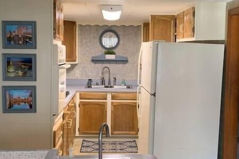 Fully equipped kitchen with gas cooktop and electric wall oven.