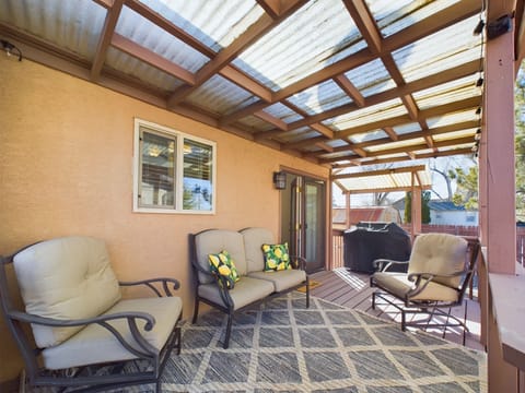 Back covered patio with gas grill