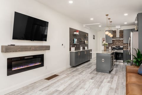 Enjoy our 55in 4K TV and Electric Fireplace that changes colors