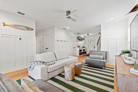 1st floor living room with 2 foldout twin beds and sliding door to the backyard. (1)