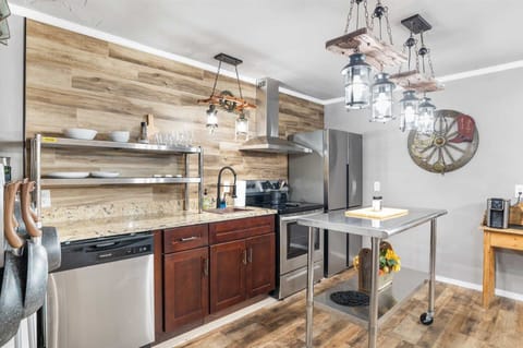 Brand-new appliances and plenty of cookware, dining ware, and utensils round out the well-appointed kitchen in the Rustic Suite!