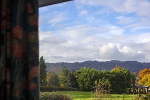 Mesmerizing views await you from Wainwright's bay window – a stunning panorama of the majestic fells, crowned with lush greenery between, providing the perfect backdrop for a tranquil and scenic escape.