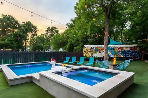 Pool And Hot Tub With Lounge Chairs And A Fire Pit For Ultimate Relaxation
